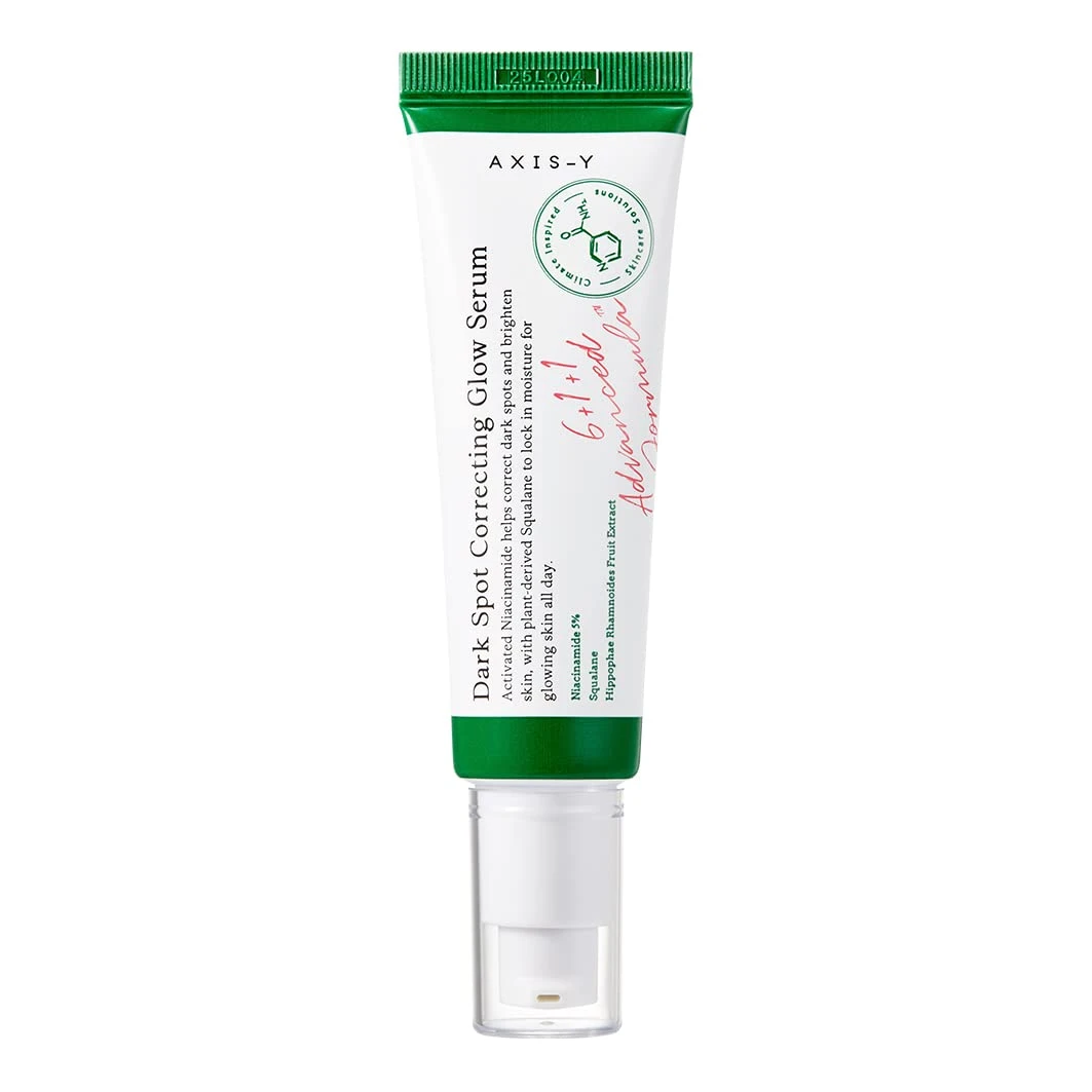 A tube of face cream with green writing on it.